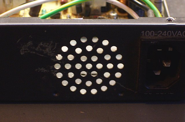 Original power supply vent holes in Linksys EG0008